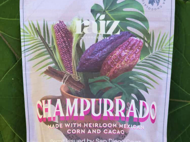 Champurrado branded flat pouch on a green background