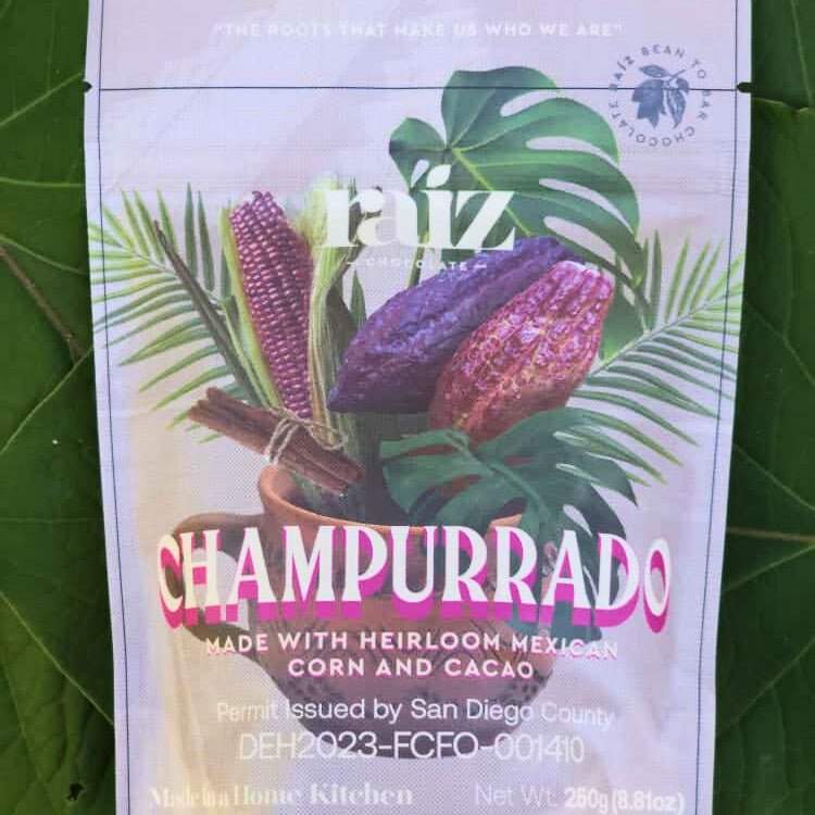 Champurrado branded flat pouch on a green background