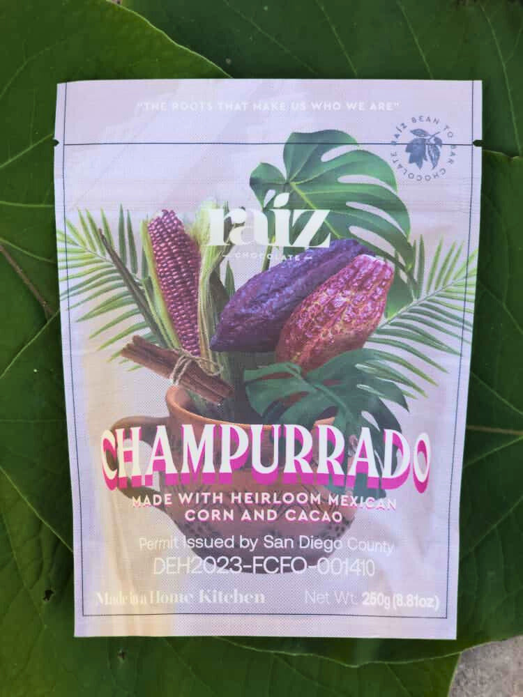Champurrado branded flat pouch on a green background